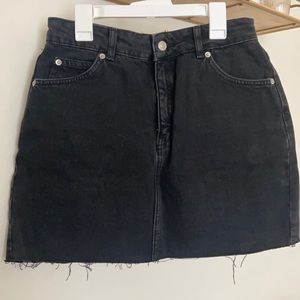 TopShop black “Moto” denim mini skirt